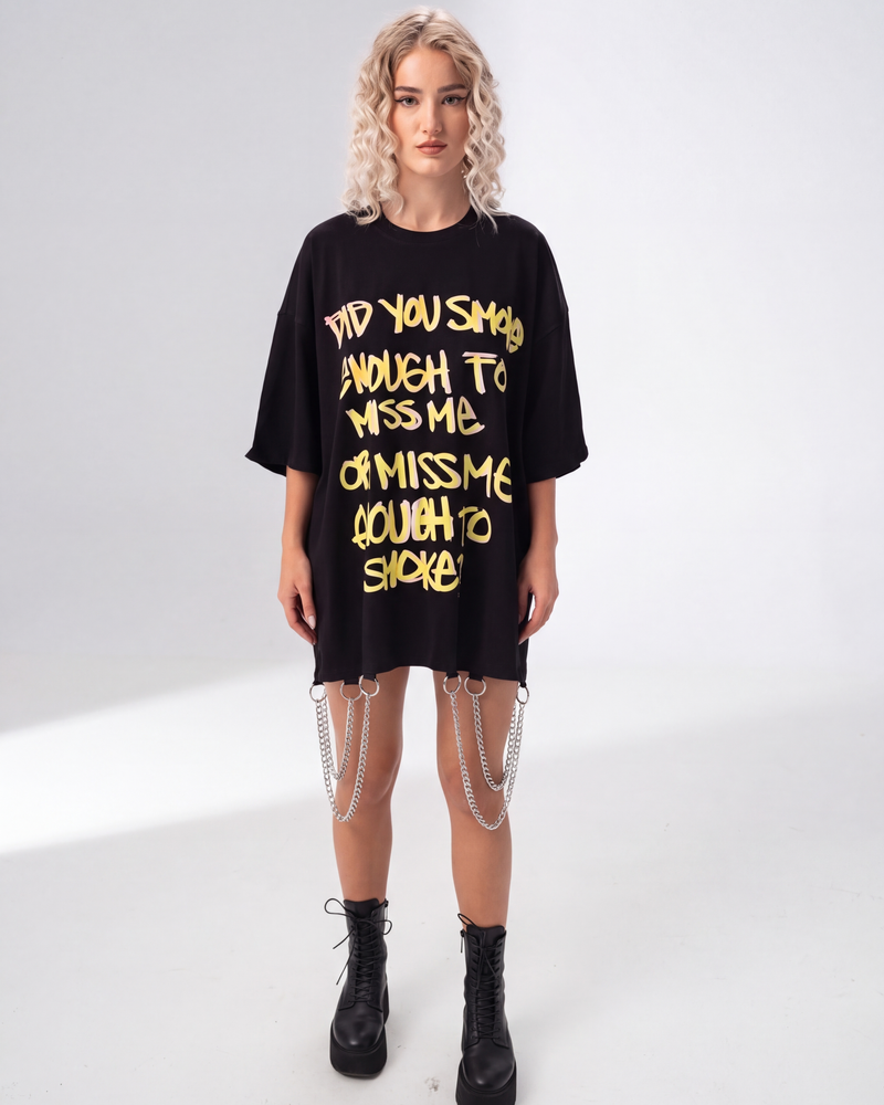Model wearing Girl Code black chain hem slogan t-shirt, front view showing handmade chain detail at hem