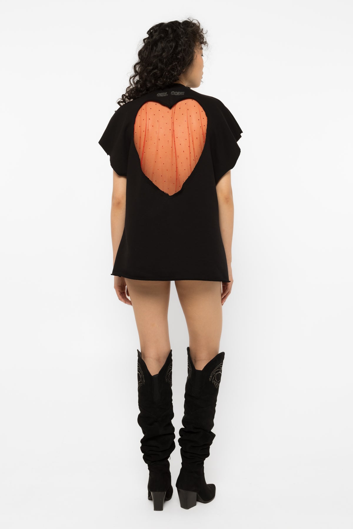 Model wearing Girl Code black heart cutout oversized t-shirt, front view