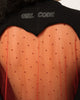 Close up of red crystals set into the tulle heart and the Girl Code back neck logo