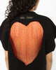 Red crystal tulle heart cutout across the back of the black oversized t-shirt