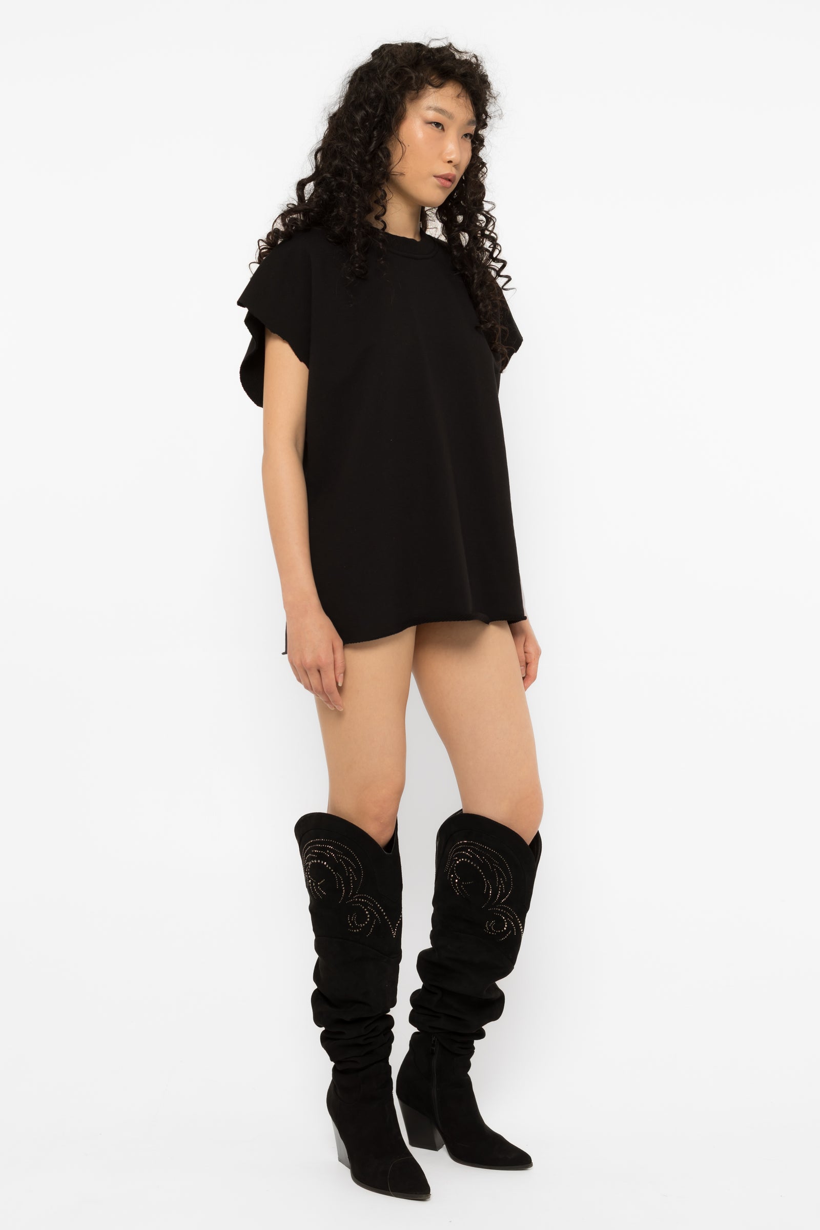 Side view of the Girl Code black oversized heart cutout t-shirt