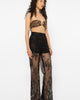 Model wearing Girl Code black lace-up palazzo pants, wide leg front view