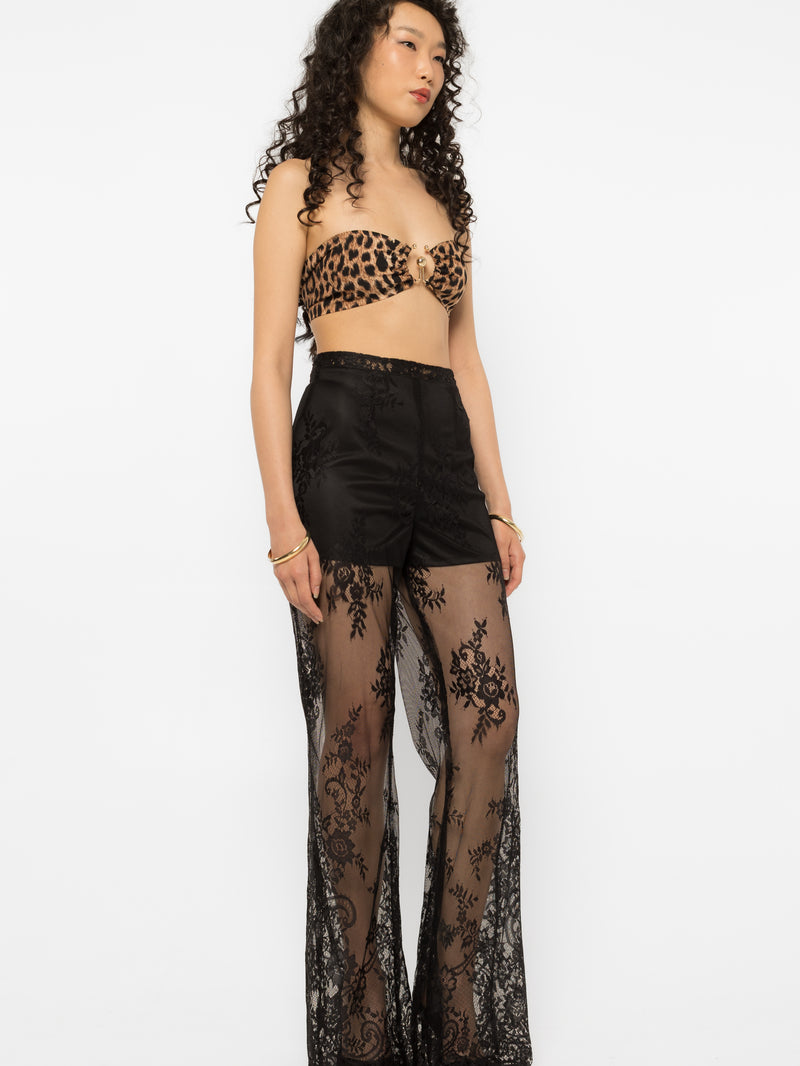 Model wearing Girl Code black lace-up palazzo pants, wide leg front view