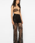 Model wearing Girl Code black lace-up palazzo pants, wide leg front view