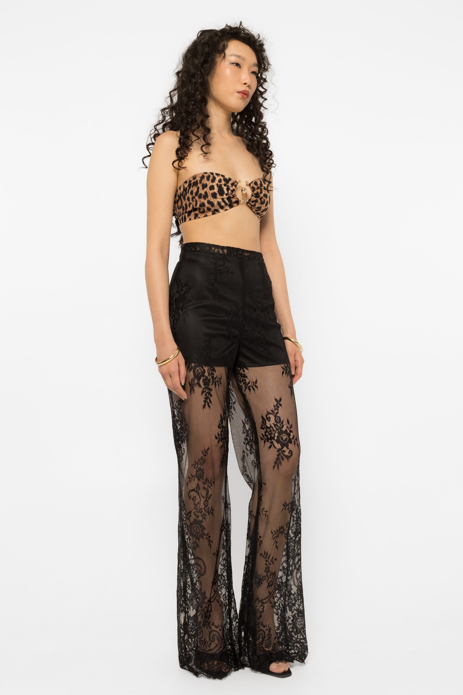 Model wearing Girl Code black lace-up palazzo pants, wide leg front view