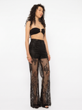 Model wearing Girl Code black lace-up palazzo pants, front view showing full wide leg silhouette