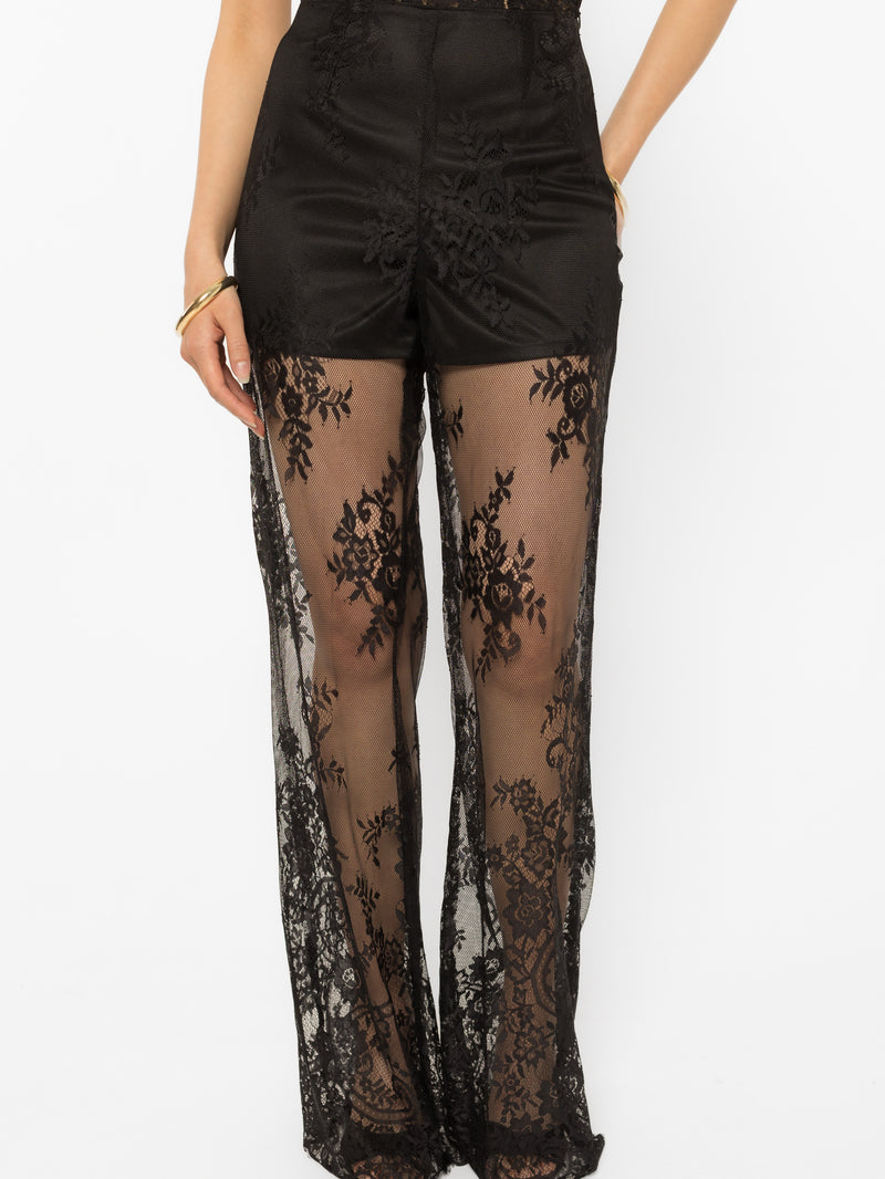 Lace-up detailing running down the leg of the black palazzo pants
