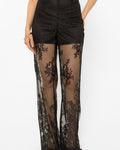 Lace-up detailing running down the leg of the black palazzo pants