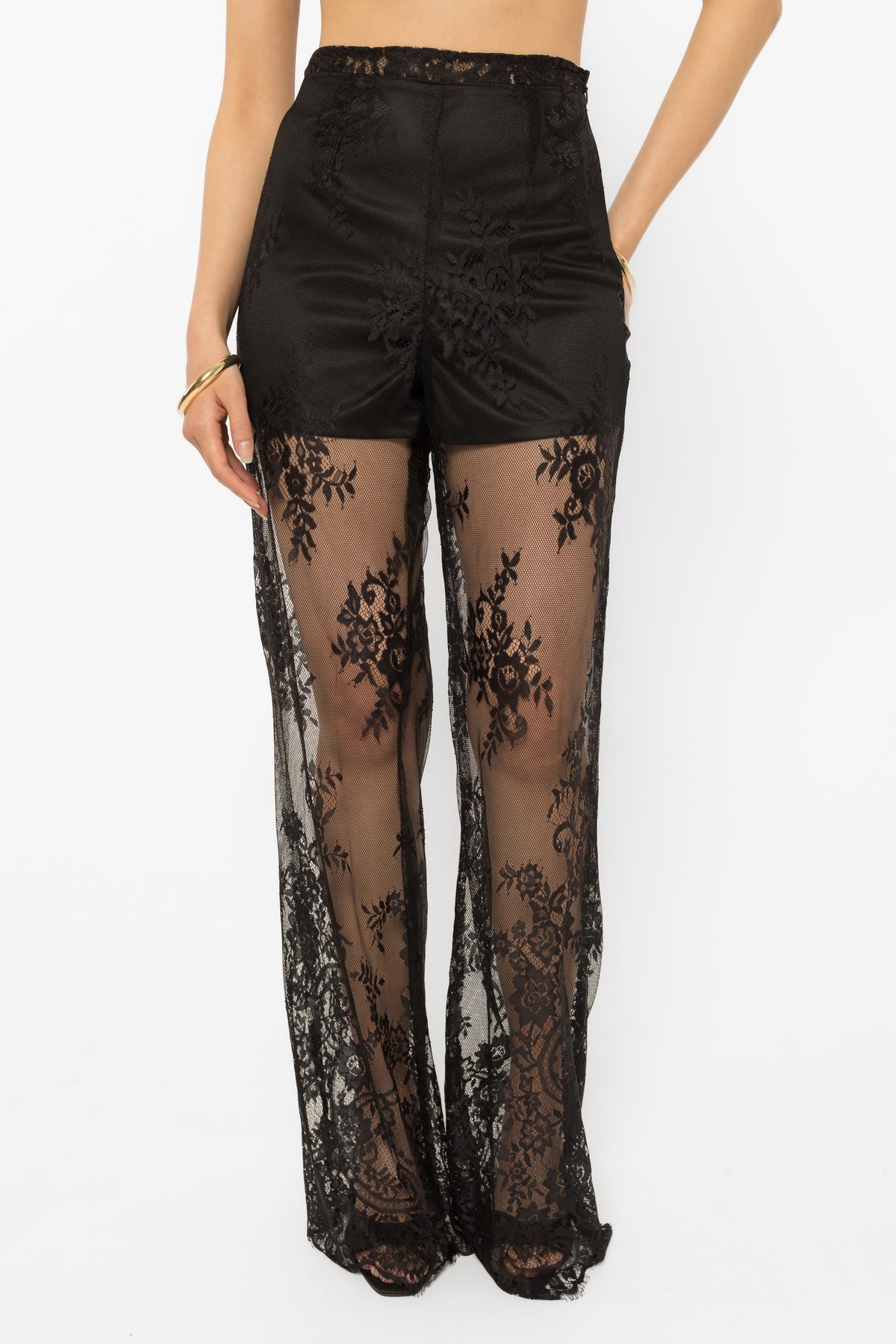 Lace-up detailing running down the leg of the black palazzo pants