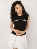 Model wearing Girl Code black pierced cutout sleeveless top, front view
