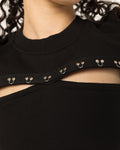 Side view of the Girl Code black pierced cutout sleeveless top