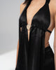 Full sweep of the black satin maxi skirt from the hip to the floor