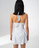 Detail of the halter neckline and centre strap on the Girl Code blue polka dot halter dress