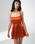 Girl Code burnt orange satin backless mini dress with a straight neckline
