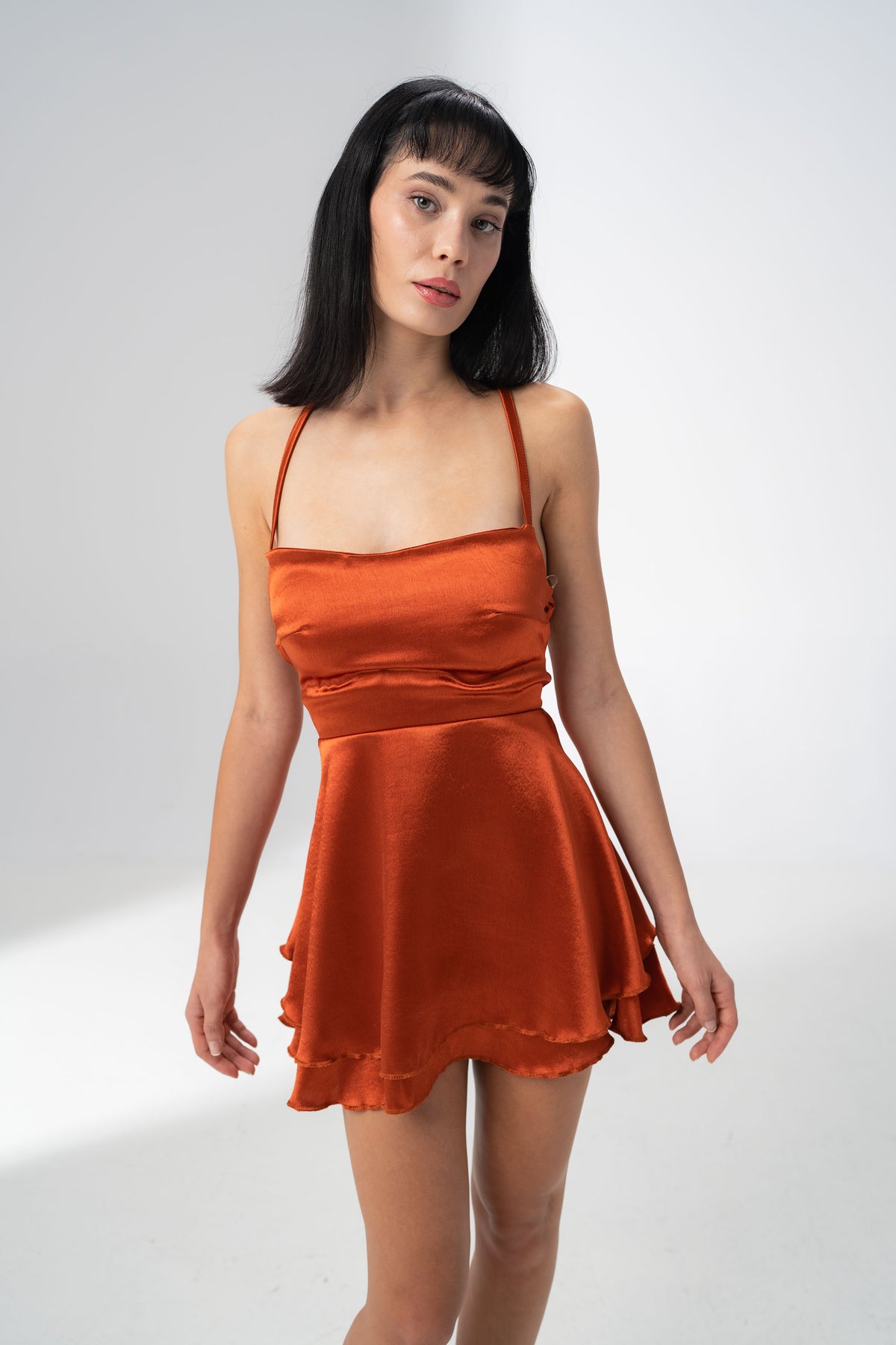 Girl Code burnt orange satin backless mini dress with a straight neckline