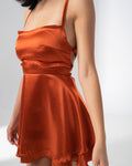 Girl Code burnt orange satin backless mini dress with crossed harness straps at the back