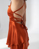 Girl Code burnt orange satin backless mini dress with a two layer ruffled skirt