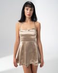 Girl Code champagne satin backless mini dress with a straight neckline