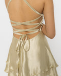 Square neckline and fitted bodice of the Girl Code champagne satin mini dress