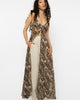 Model wearing Girl Code leopard print long shirt open over cream tailored trousers