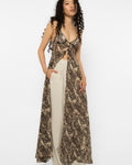 Model wearing Girl Code leopard print long shirt open over cream tailored trousers