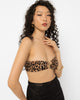 Model wearing Girl Code leopard print strapless top with a gold ring at the centre