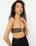 Model wearing Girl Code leopard print strapless top with a gold ring at the centre