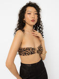 Model wearing Girl Code leopard print strapless top with a gold ring at the centre