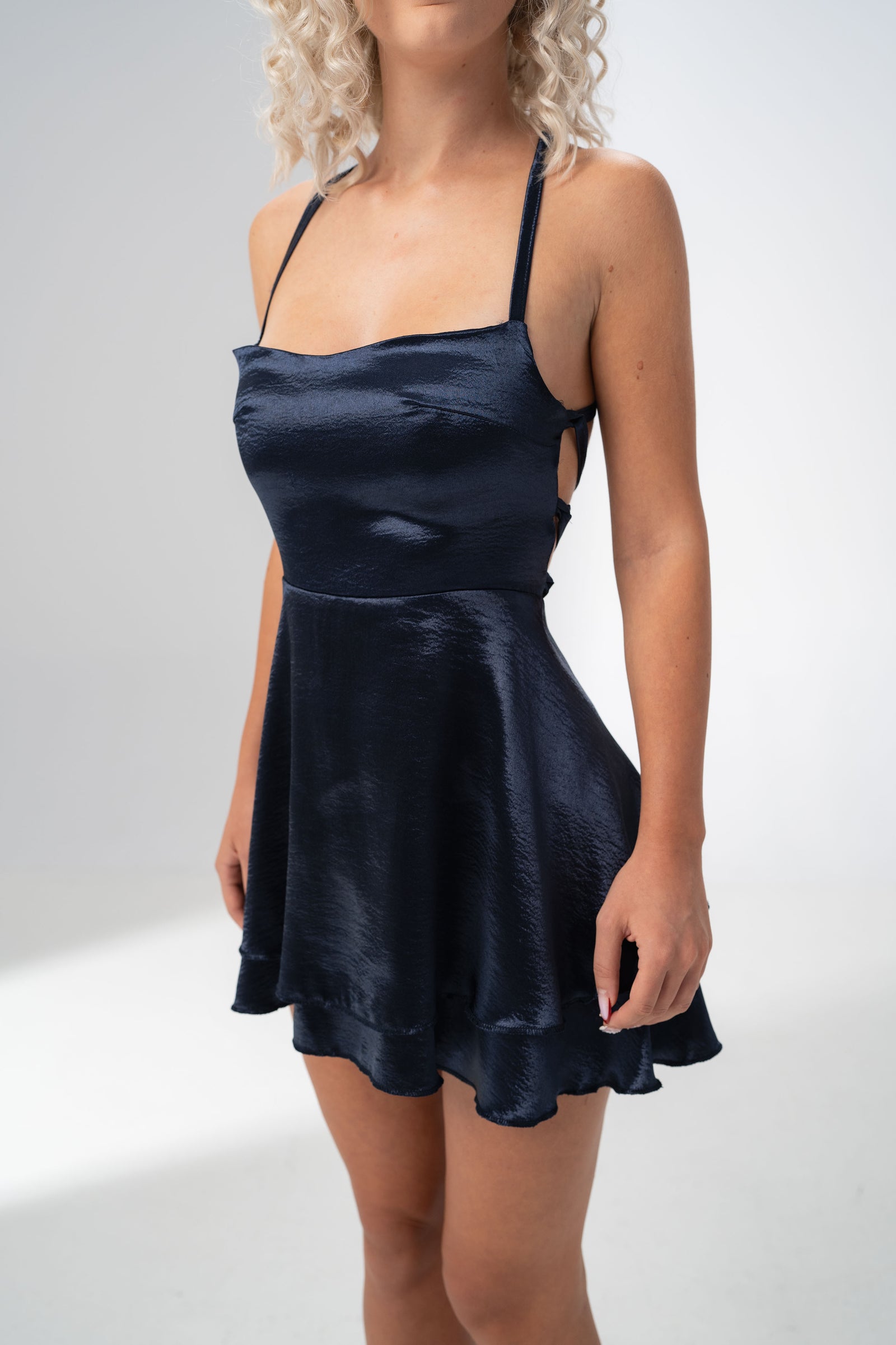 Girl Code navy satin backless mini dress with crossed harness straps at the back