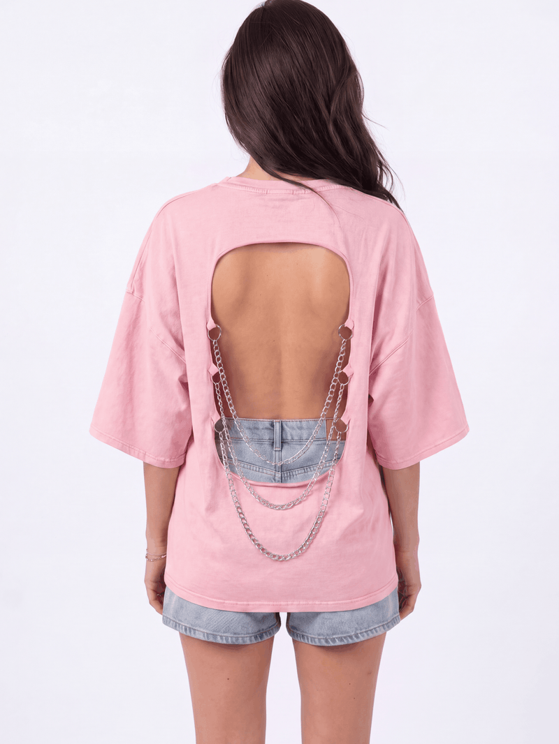 Back view of the Girl Code pink chain back slogan t-shirt showing open back cutout with silver chains