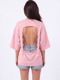 Back view of the Girl Code pink chain back slogan t-shirt showing open back cutout with silver chains