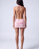 Back view of the Girl Code pink ribbed halter mini dress showing fully open back and GIRL CODE pink logo print