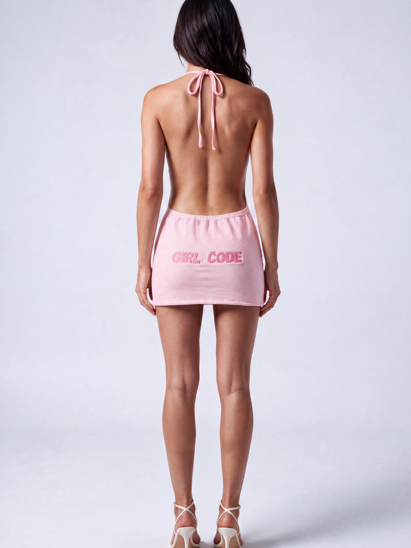Back view of the Girl Code pink ribbed halter mini dress showing fully open back and GIRL CODE pink logo print