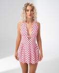 Girl Code polka dot halter mini dress showing the fitted bodice and cutout under the bust