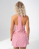 Open back and halter tie detail of the Girl Code polka dot halter mini dress