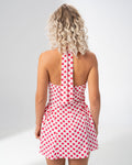 Open back and halter tie detail of the Girl Code polka dot halter mini dress