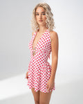 Girl Code polka dot halter mini dress worn with clear heels
