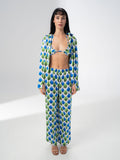 Model wearing the Girl Code printed satin three piece set with bralette, wide leg trousers and open shirt