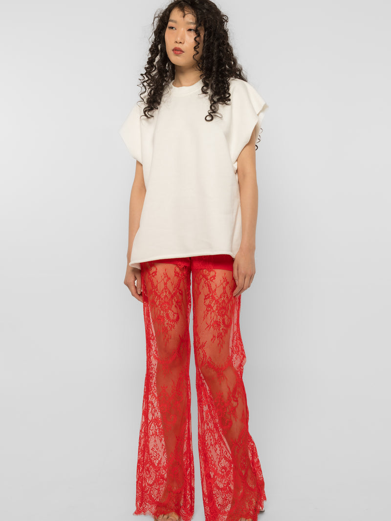 Model wearing Girl Code red lace-up palazzo pants, wide leg front view