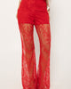 Lace-up detailing running down the leg of the red palazzo pants