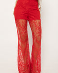 Lace-up detailing running down the leg of the red palazzo pants