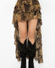 Floor sweeping ruffled back train of the sheer snake print skirt