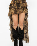 Floor sweeping ruffled back train of the sheer snake print skirt