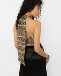 Close up of the beige brown and black snake print fabric on the halter crop top
