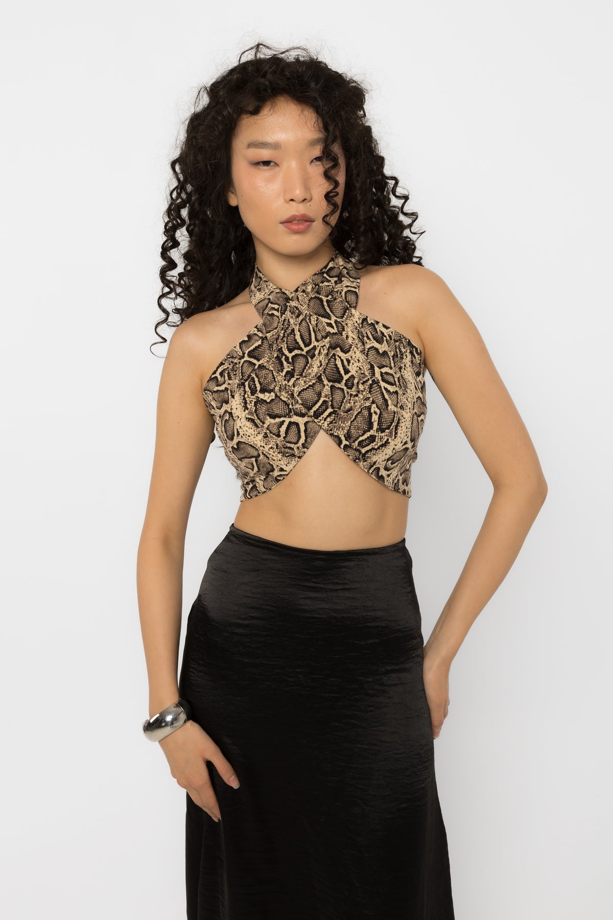 Crossover wrap front of the snake print halter crop top, close view