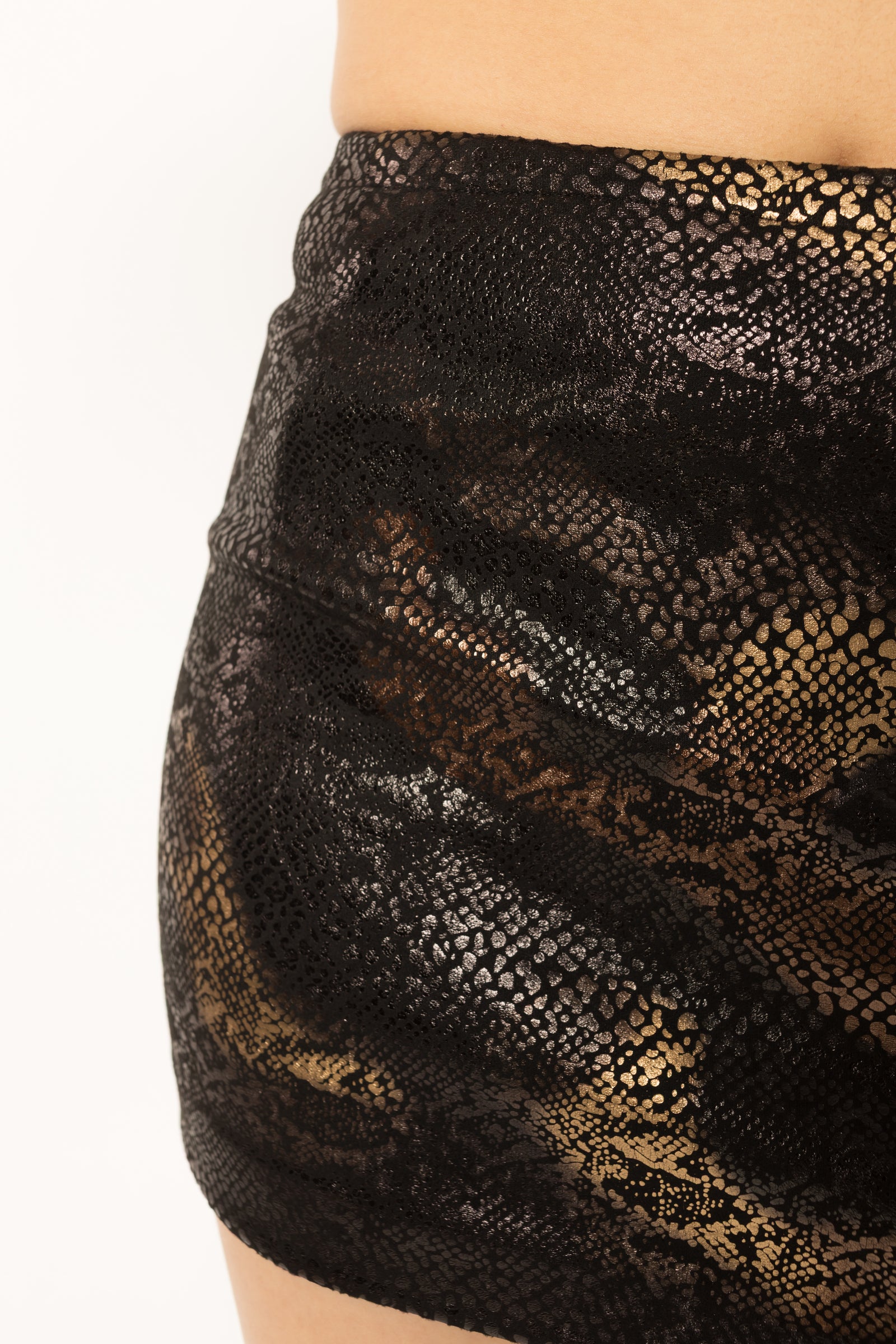 Close up of the black and gold suede-touch snake print fabric