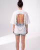 Back view of the Girl Code white chain back slogan t-shirt showing the open back cutout with silver chains