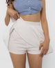 Full gathered volume of the white cotton poplin mini skirt in movement