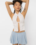 Model wearing Girl Code white cotton shirt halter top with keyhole cutout