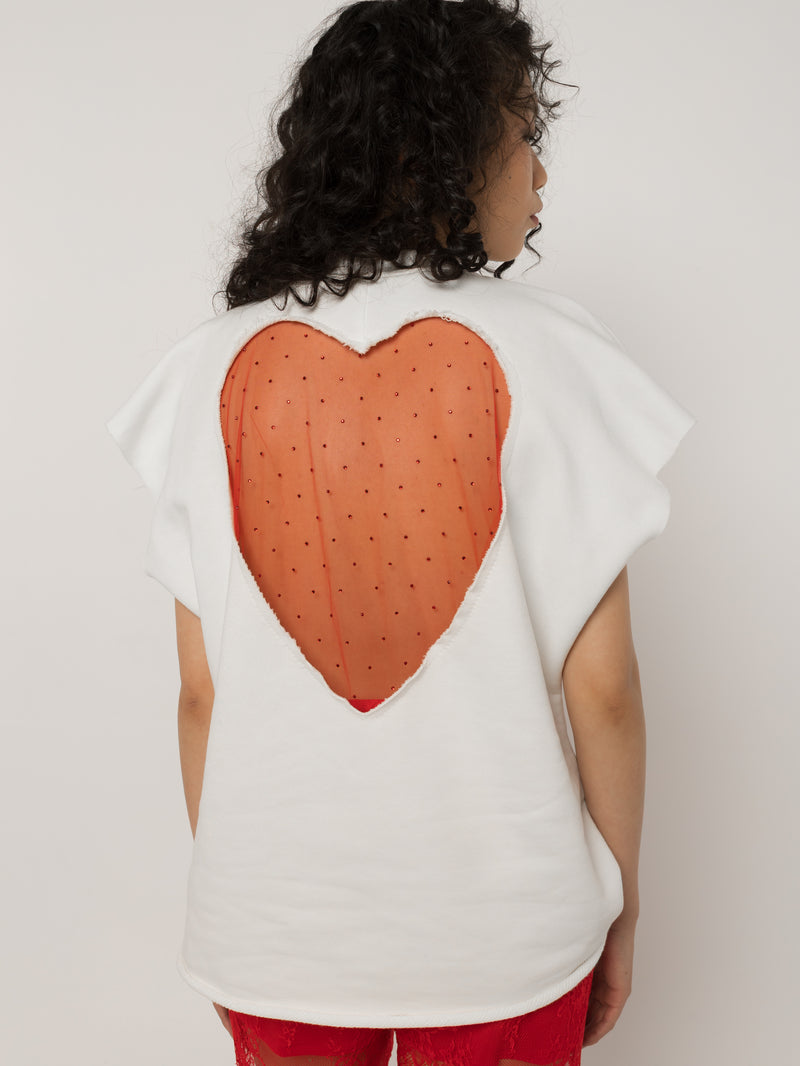 Model wearing Girl Code white heart cutout oversized t-shirt, front view